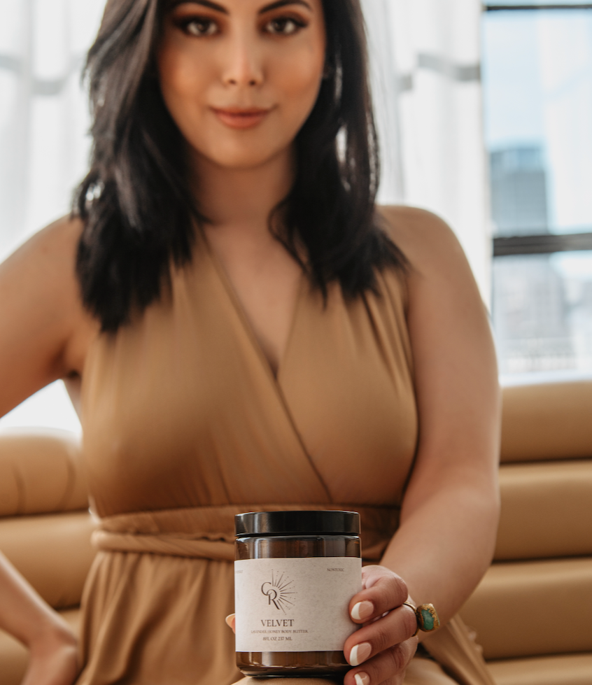 Woman applying Velvet Lavender Honey Body Butter during self-care routine
