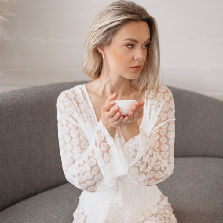 Woman sipping Relax Loose Leaf Tea during peaceful evening routine
